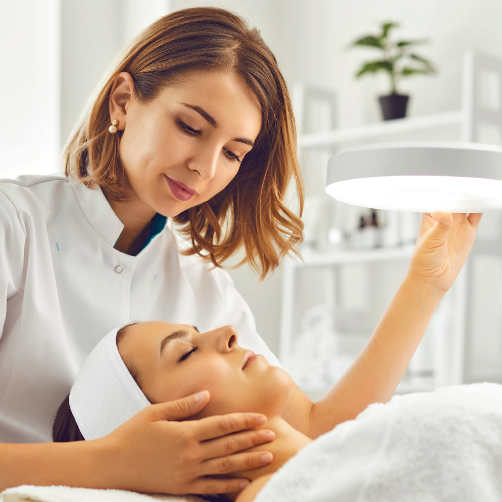 Woman receiving a facial treatment in a spa setting.