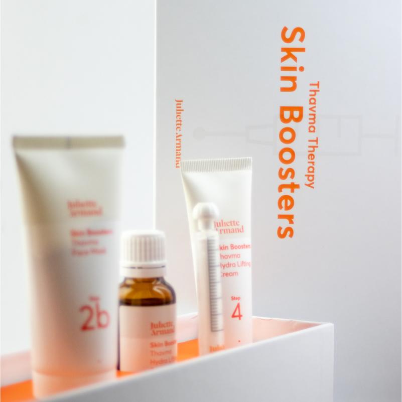 Collection of skincare products with 'Thavma Therapy Skin Boosters' branding on a white background